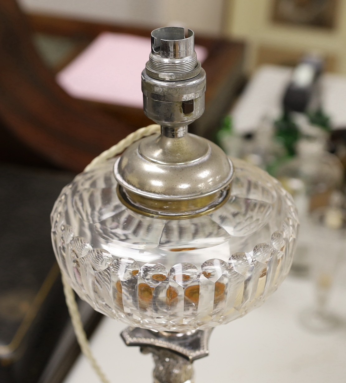 A Walker & Hall silver plated Corinthian column oil lamp converted to electricity as a lamp base, 49cms including light fitting